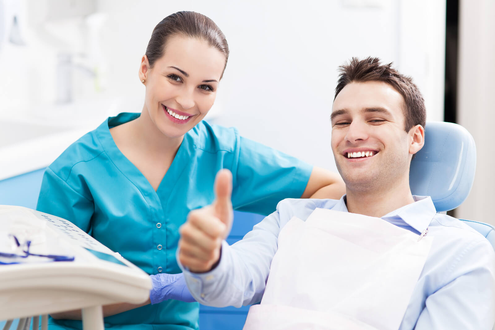 Happy patient in dental chair